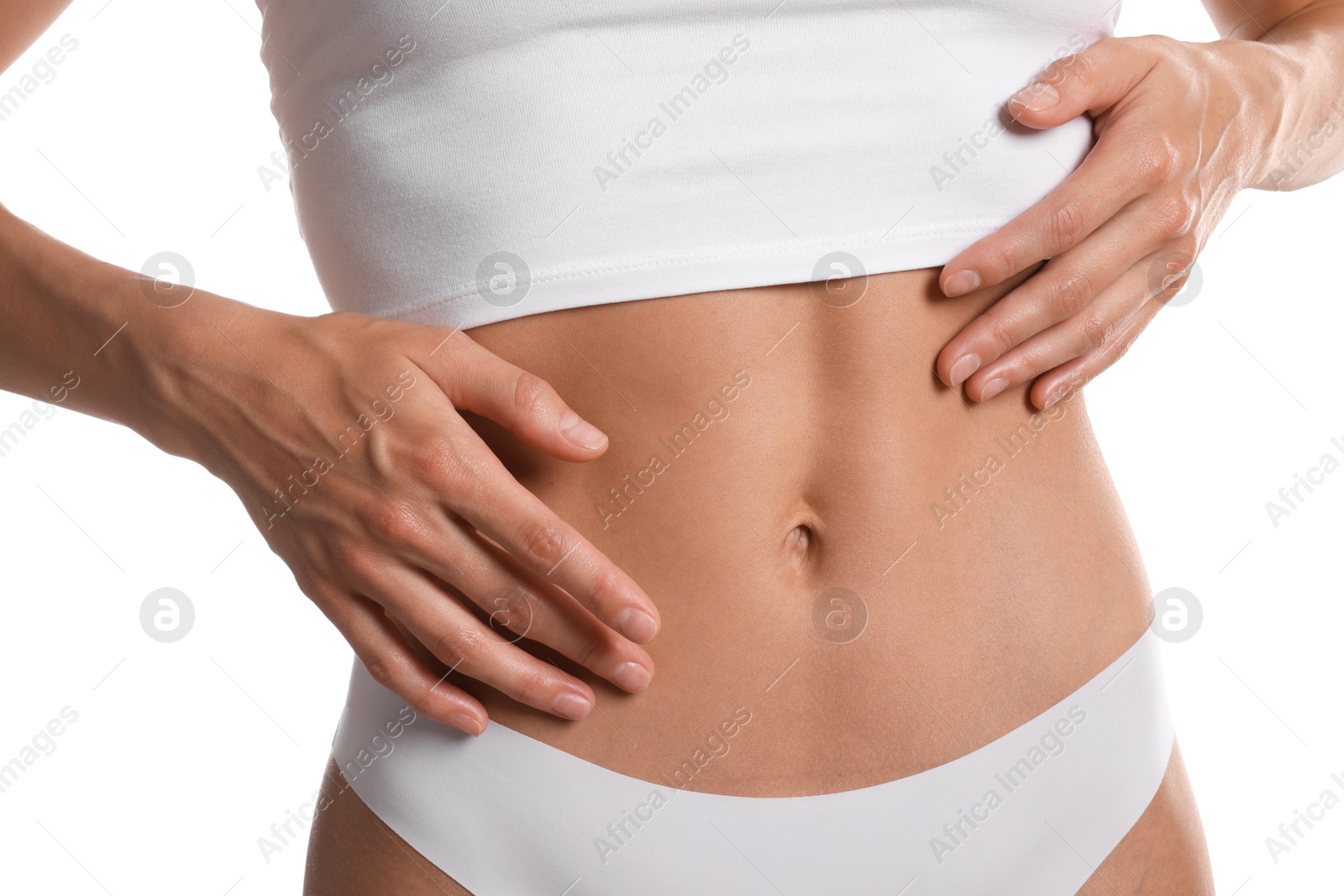 Woman with flat belly on white background, closeup Photo of Woman with flat belly on white background, closeup