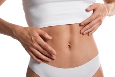 Photo of Woman with flat belly on white background, closeup