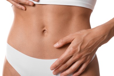 Photo of Woman with flat belly on white background, closeup
