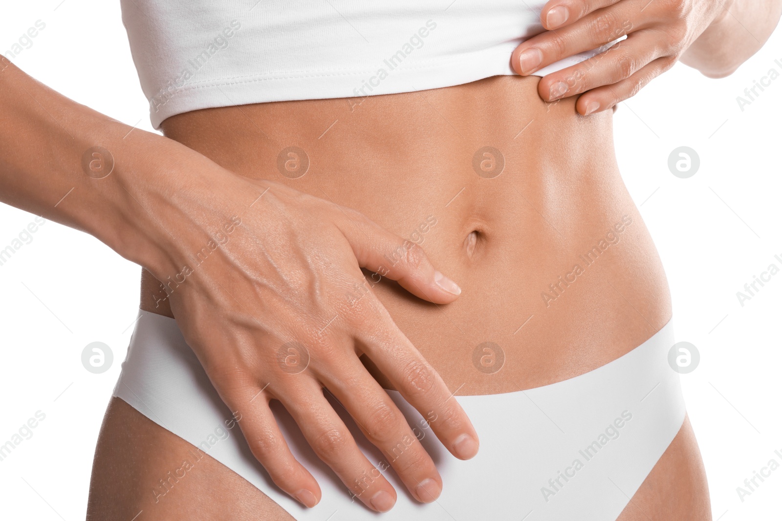 Woman with flat belly on white background, closeup Photo of Woman with flat belly on white background, closeup
