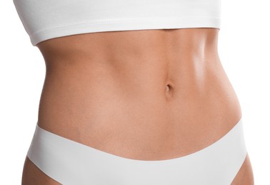 Photo of Woman with flat belly on white background, closeup