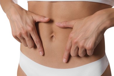 Photo of Woman with flat belly on white background, closeup