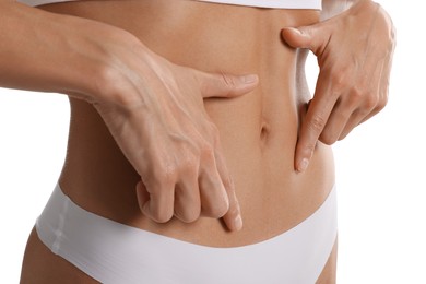 Photo of Woman with flat belly on white background, closeup