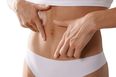 Photo of Woman with flat belly on white background, closeup