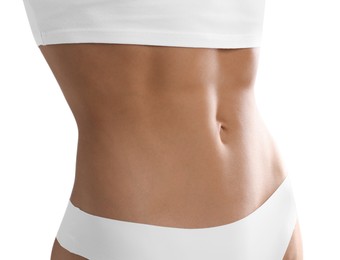 Photo of Woman with flat belly on white background, closeup