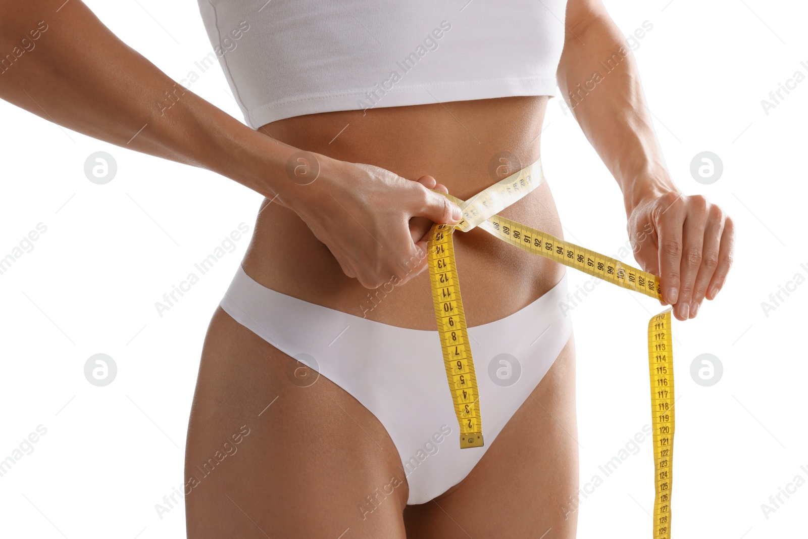 Woman measuring her belly with tape on white background, closeup Photo of Woman measuring her belly with tape on white background, closeup