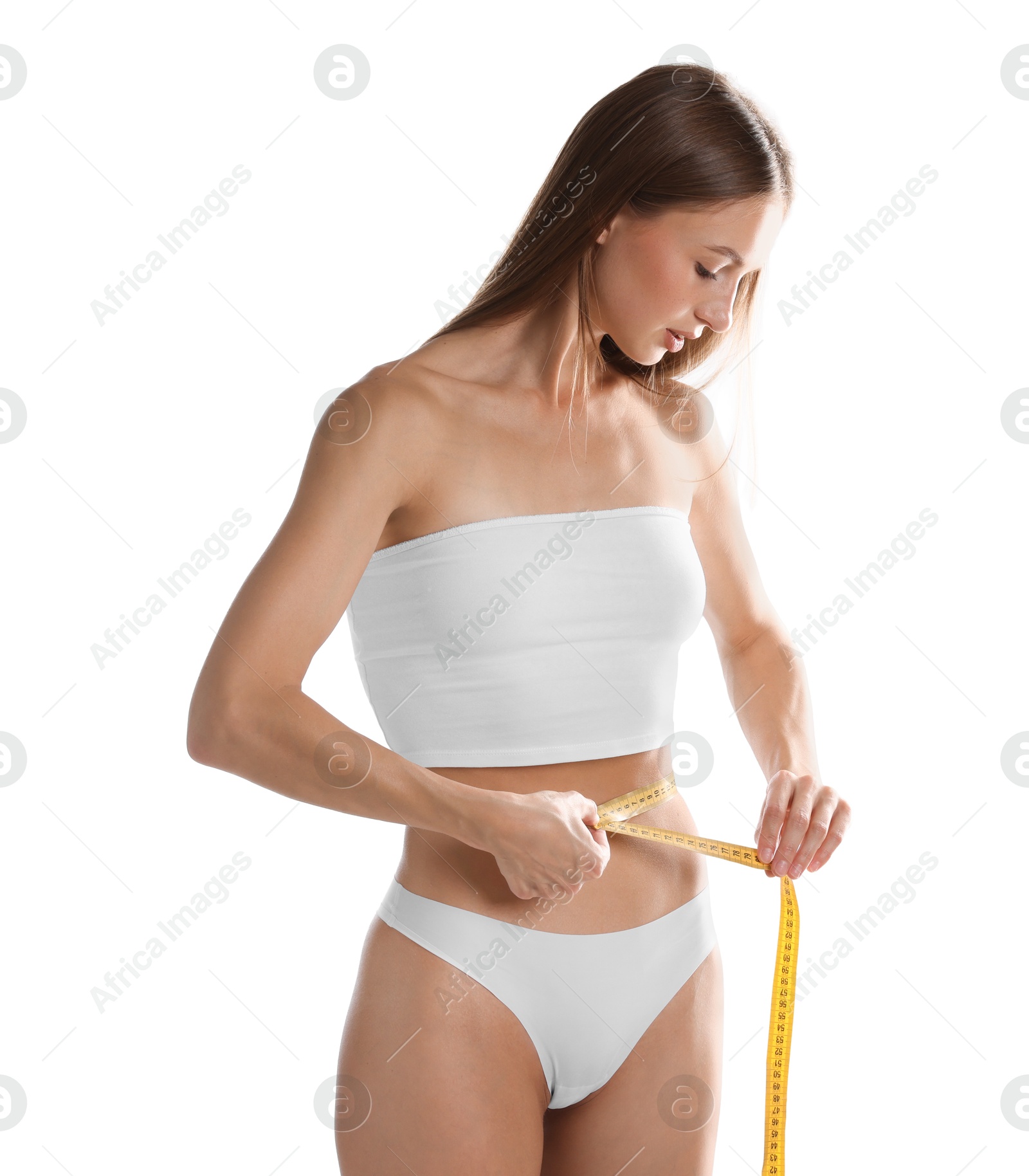 Woman measuring her belly with tape on white background Photo of Woman measuring her belly with tape on white background