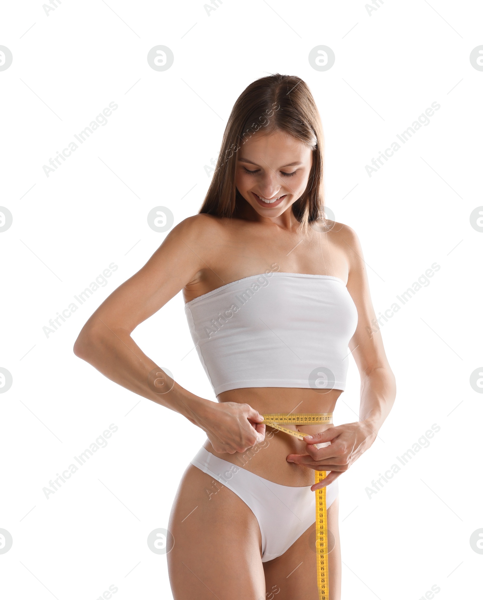 Woman measuring her belly with tape on white background Photo of Woman measuring her belly with tape on white background