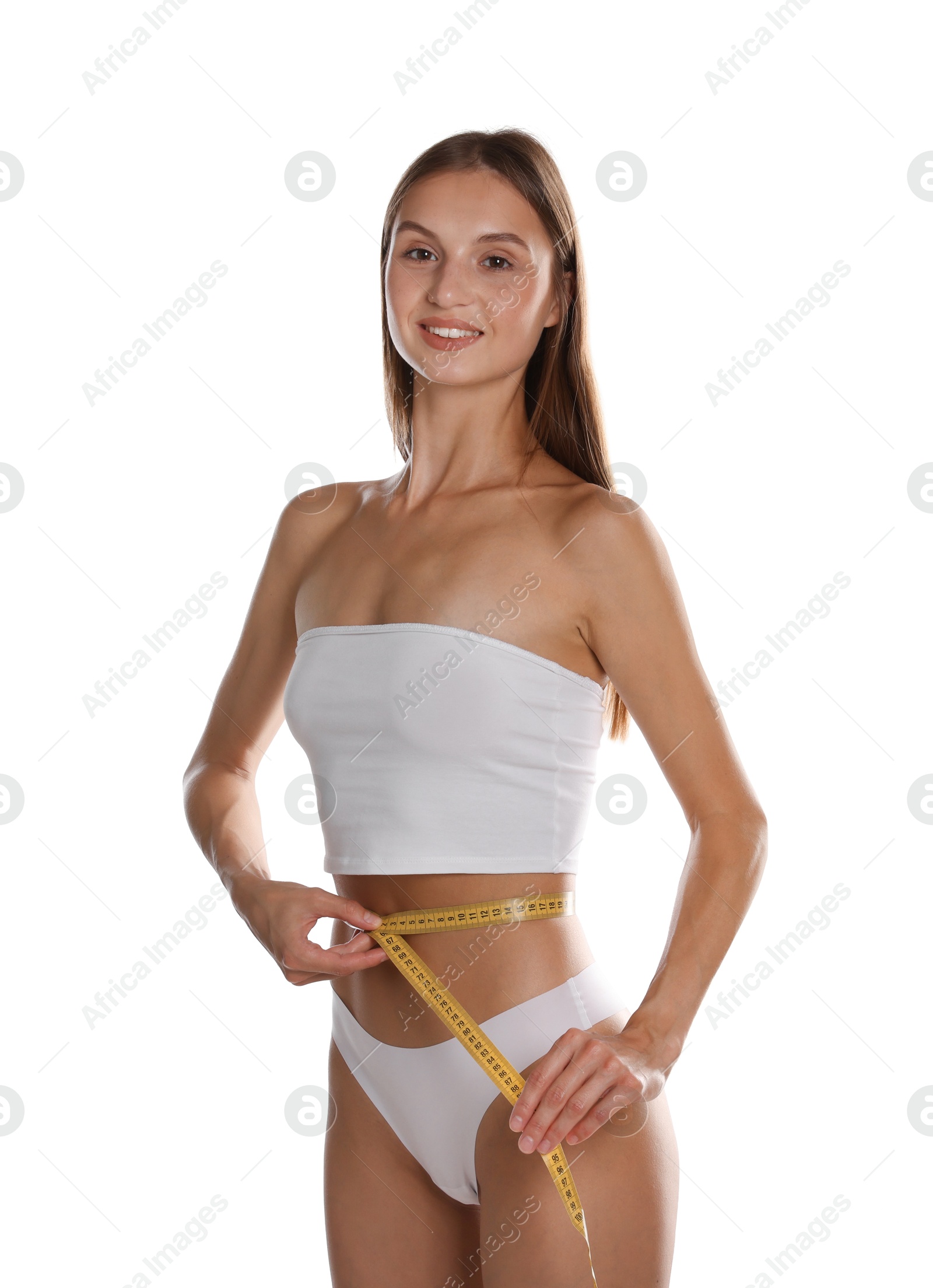 Woman measuring her belly with tape on white background Photo of Woman measuring her belly with tape on white background