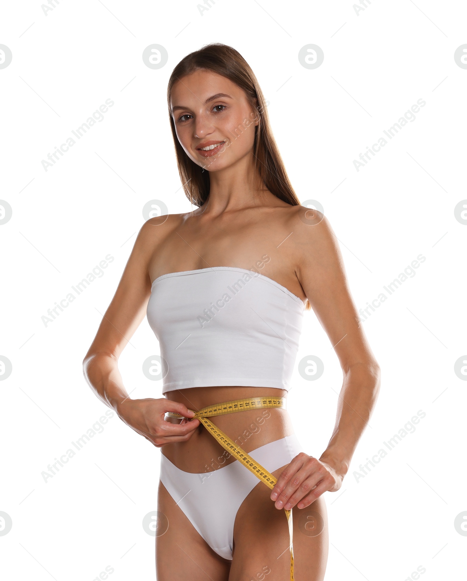 Woman measuring her belly with tape on white background Photo of Woman measuring her belly with tape on white background