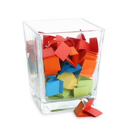 Photo of Colorful paper pieces in glass jar isolated on white