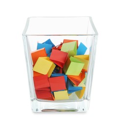 Photo of Colorful paper pieces in glass jar isolated on white