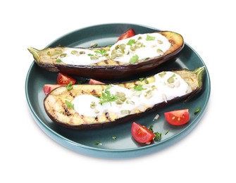 Photo of Slices of grilled eggplant with pumpkin seeds and yoghurt isolated on white
