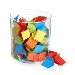 Photo of Many colorful paper pieces in glass isolated on white