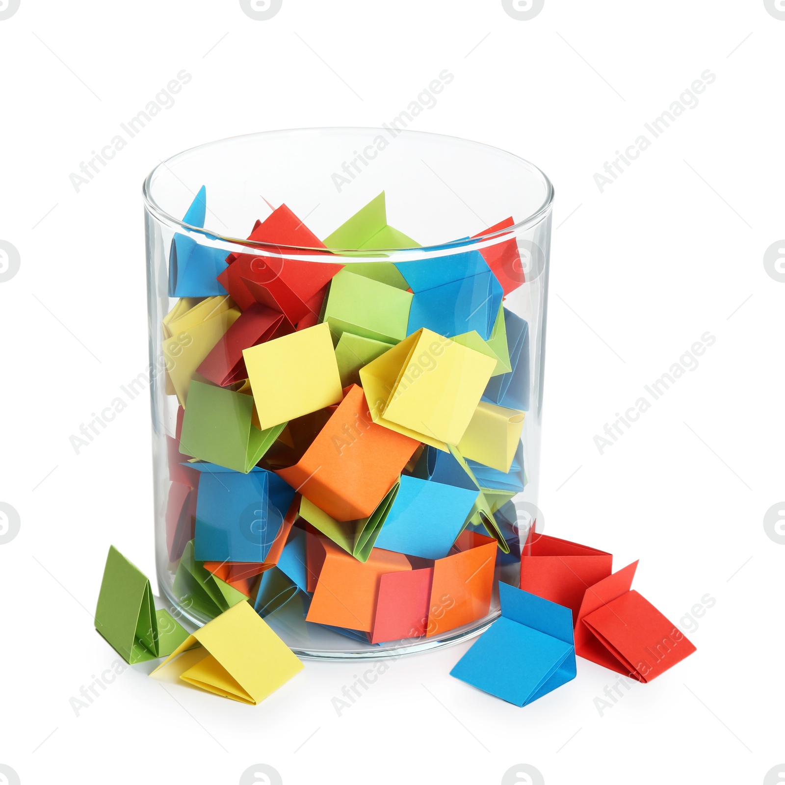 Many colorful paper pieces in glass isolated on white Photo of Many colorful paper pieces in glass isolated on white