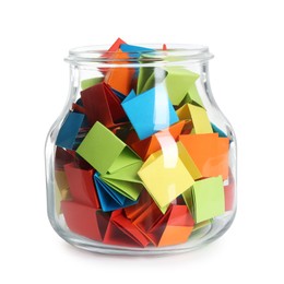 Photo of Many colorful paper pieces in glass jar isolated on white