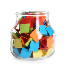 Photo of Many colorful paper pieces in glass jar isolated on white