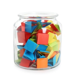 Photo of Many colorful paper pieces in glass jar isolated on white
