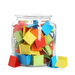 Photo of Many colorful paper pieces in glass jar isolated on white