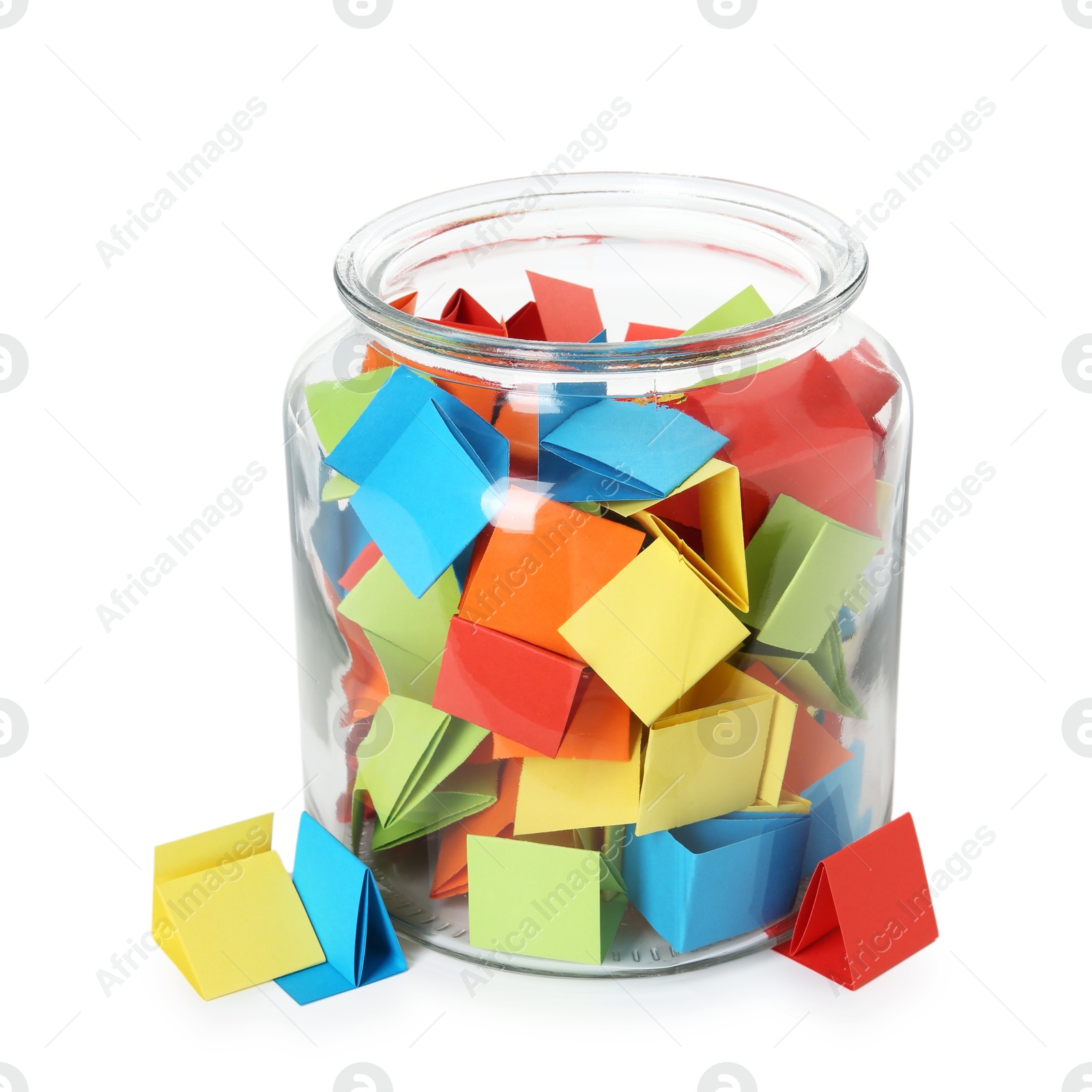 Many colorful paper pieces in glass jar isolated on white Photo of Many colorful paper pieces in glass jar isolated on white