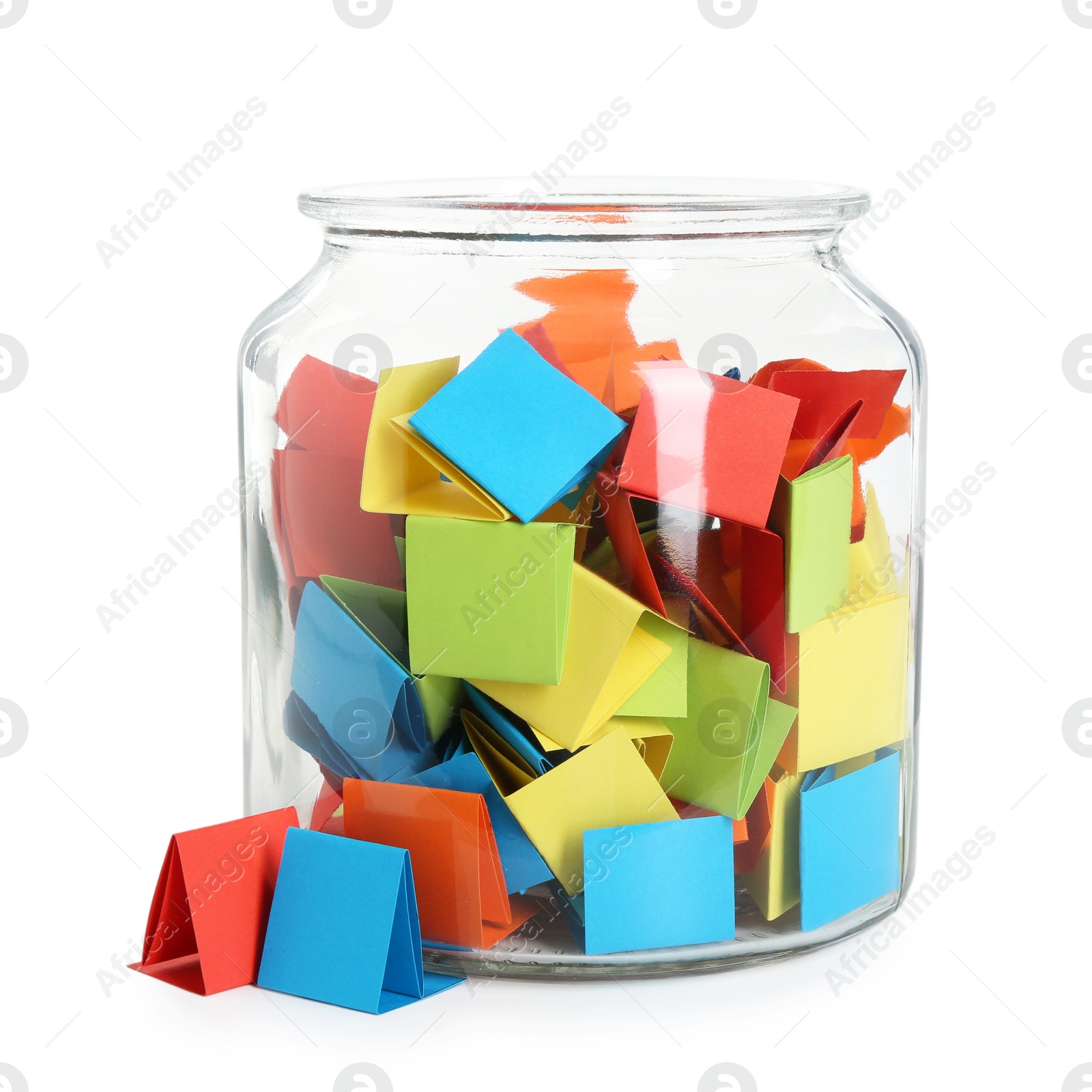 Many colorful paper pieces in glass jar isolated on white Photo of Many colorful paper pieces in glass jar isolated on white