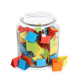 Photo of Many colorful paper pieces in glass jar isolated on white
