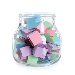 Photo of Many colorful paper pieces in glass jar isolated on white