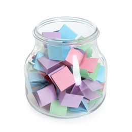 Photo of Many colorful paper pieces in glass jar isolated on white