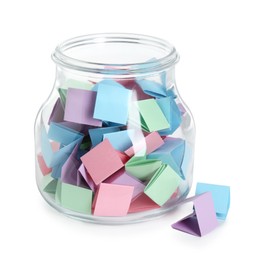 Photo of Many colorful paper pieces in glass jar isolated on white