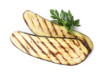 Photo of Slices of grilled eggplant and parsley isolated on white, top view
