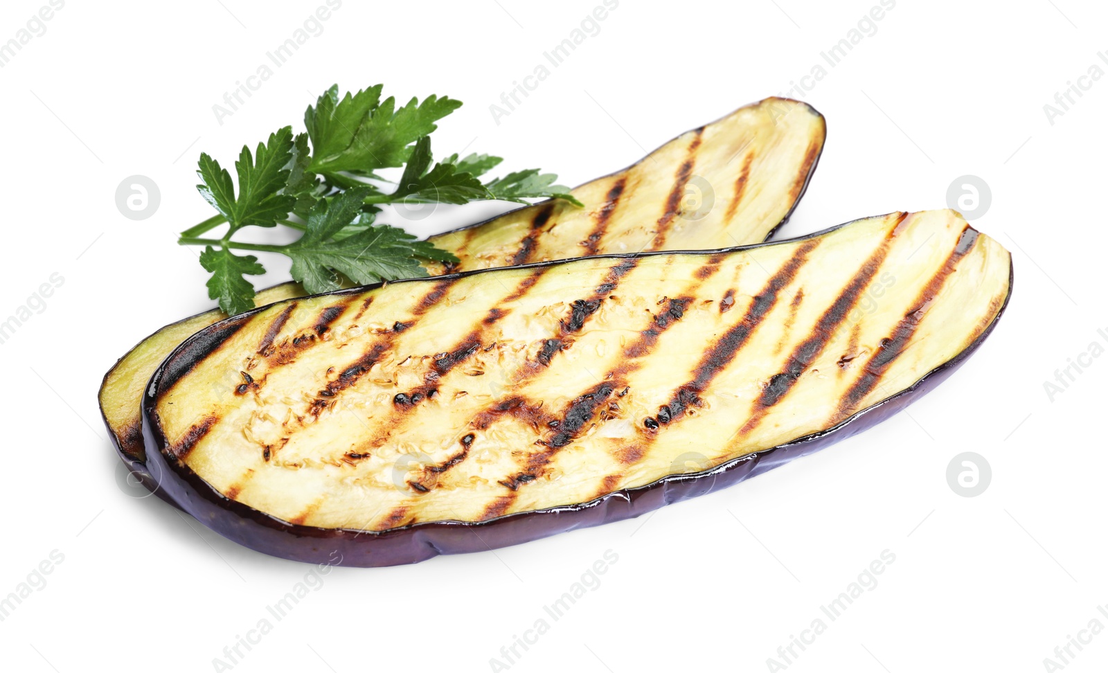 Slices of grilled eggplant and parsley isolated on white Photo of Slices of grilled eggplant and parsley isolated on white