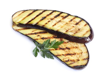 Photo of Slices of grilled eggplant and parsley isolated on white