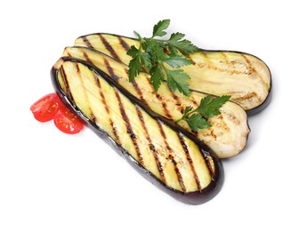 Photo of Slices of grilled eggplant, parsley and tomatoes isolated on white, top view