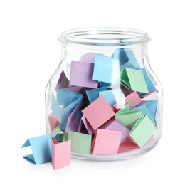 Photo of Many colorful paper pieces in glass jar isolated on white