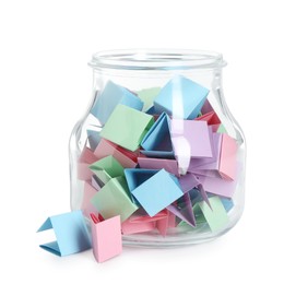 Photo of Many colorful paper pieces in glass jar isolated on white