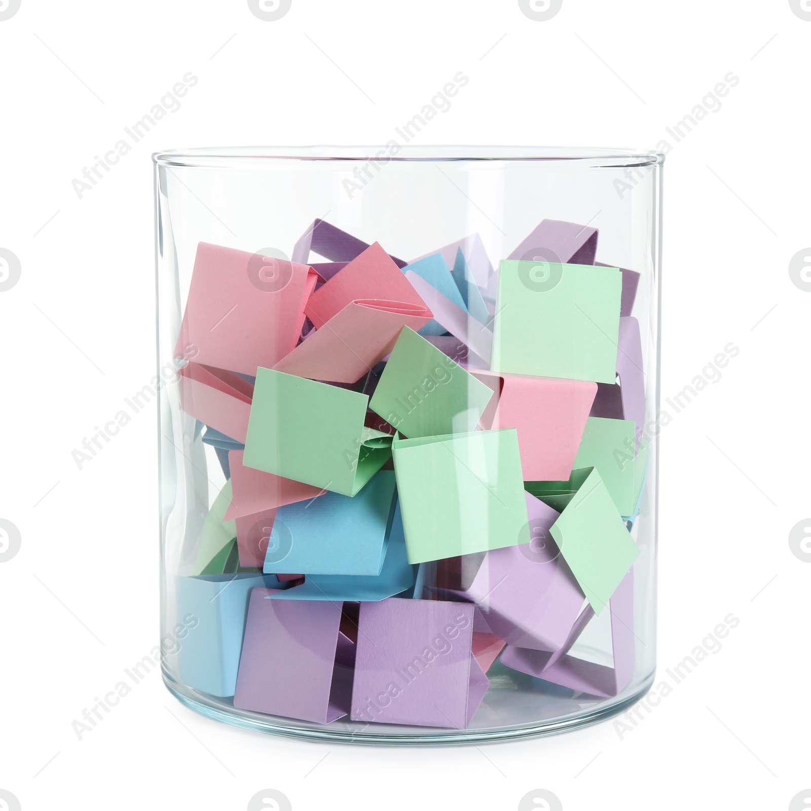 Many colorful paper pieces in glass isolated on white Photo of Many colorful paper pieces in glass isolated on white