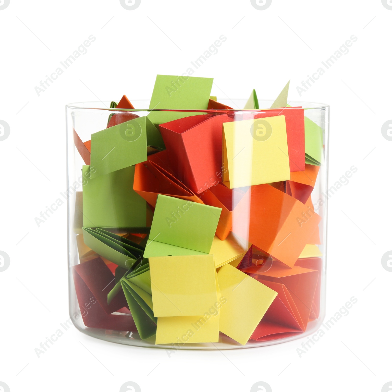 Many colorful paper pieces in glass isolated on white Photo of Many colorful paper pieces in glass isolated on white