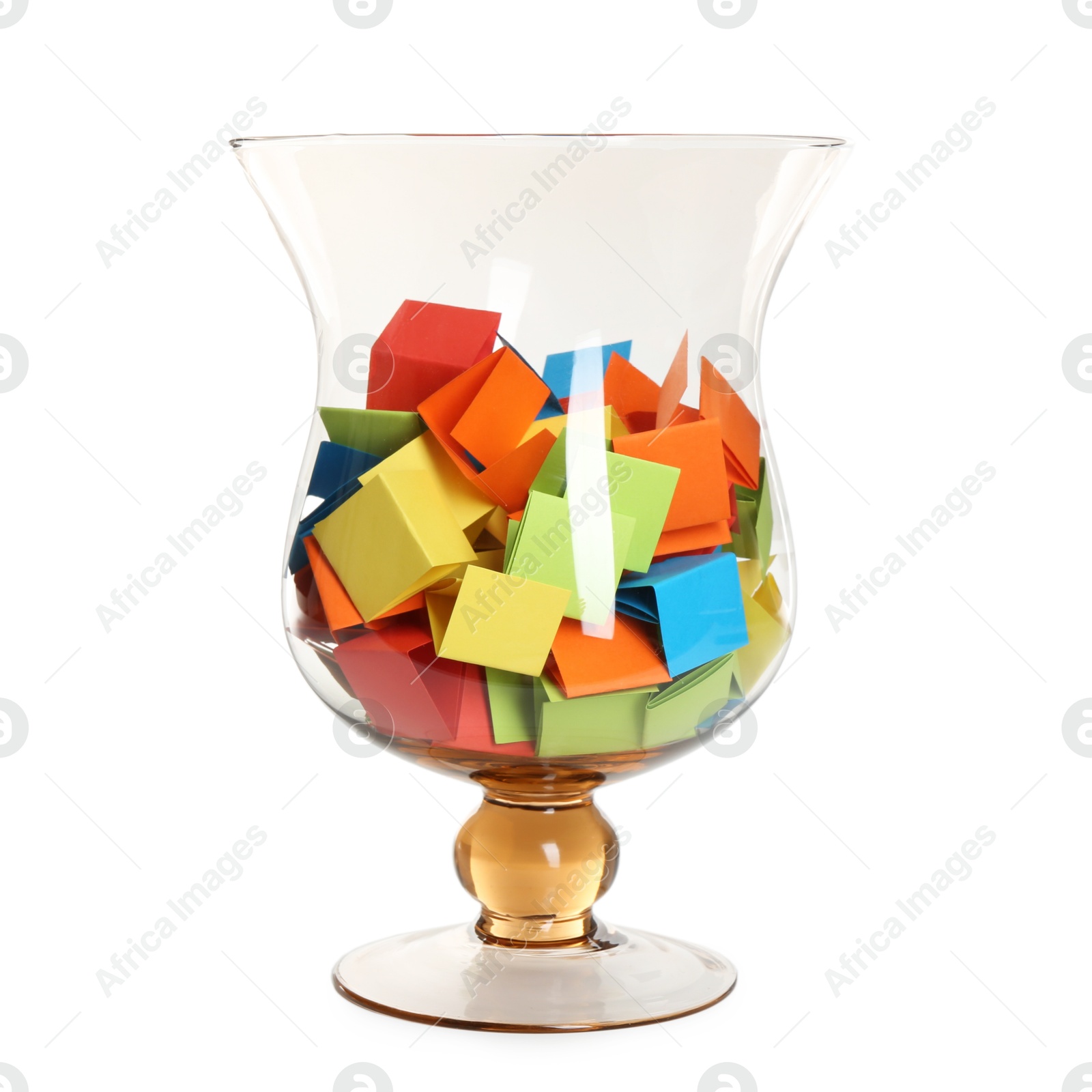 Many colorful paper pieces in glass isolated on white Photo of Many colorful paper pieces in glass isolated on white