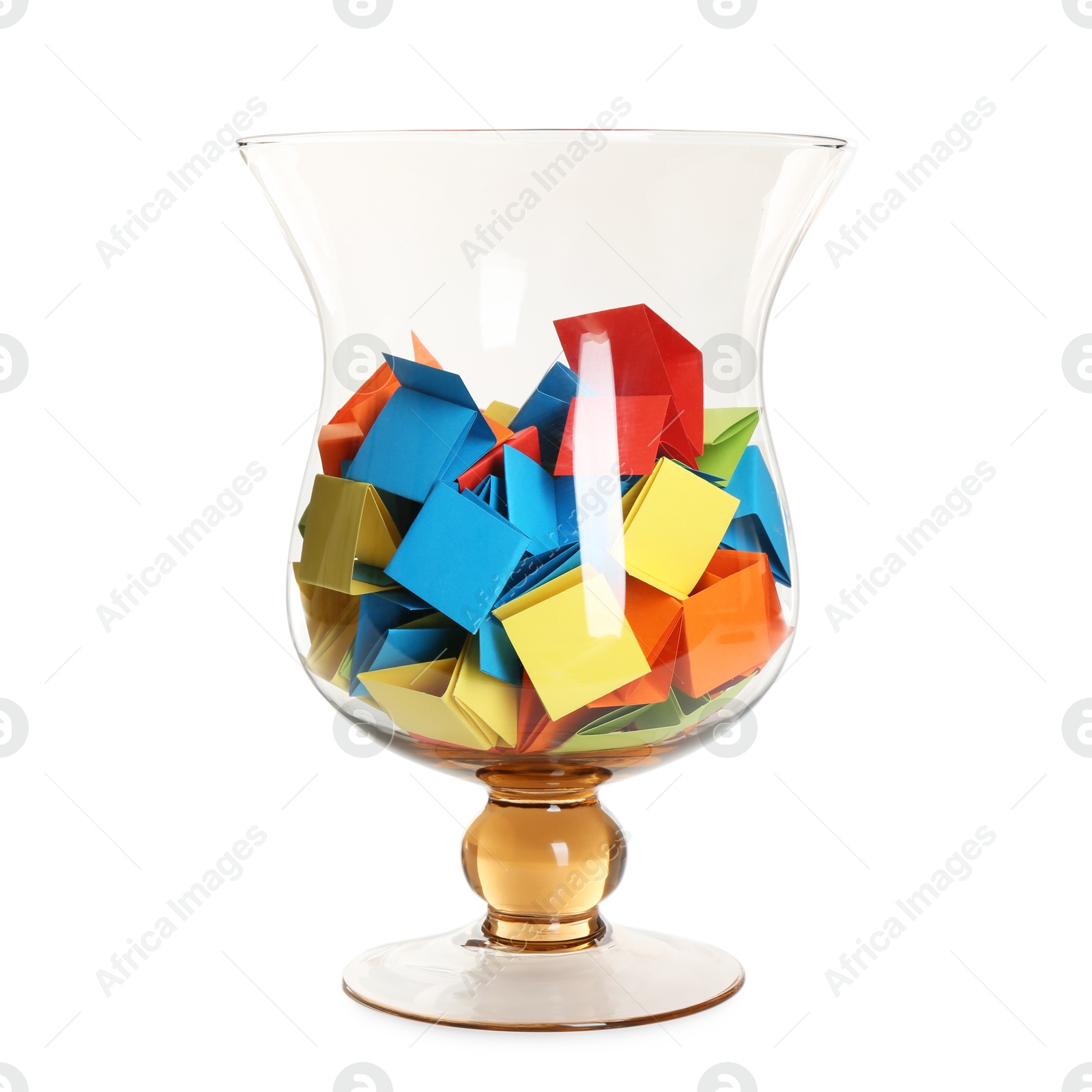 Many colorful paper pieces in glass isolated on white Photo of Many colorful paper pieces in glass isolated on white
