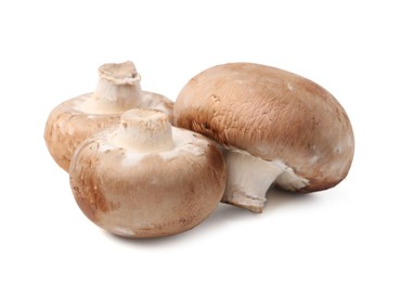 Photo of Fresh raw champignon mushrooms isolated on white