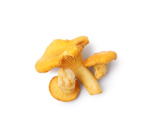 Photo of Fresh raw chanterelle mushrooms isolated on white, top view