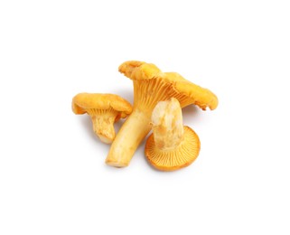 Photo of Fresh raw chanterelle mushrooms isolated on white, top view