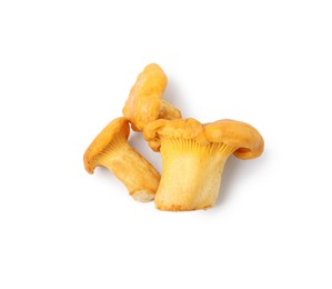 Photo of Fresh raw chanterelle mushrooms isolated on white, top view