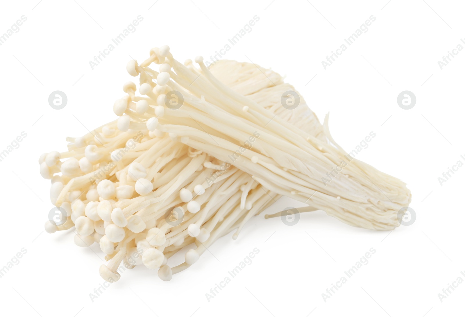 Clusters of fresh enoki mushrooms isolated on white Photo of Clusters of fresh enoki mushrooms isolated on white