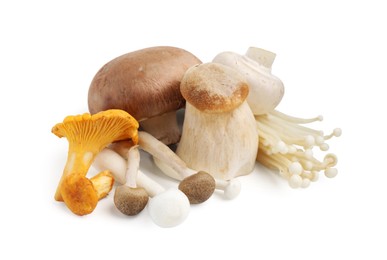 Photo of Collection of different raw mushrooms isolated on white