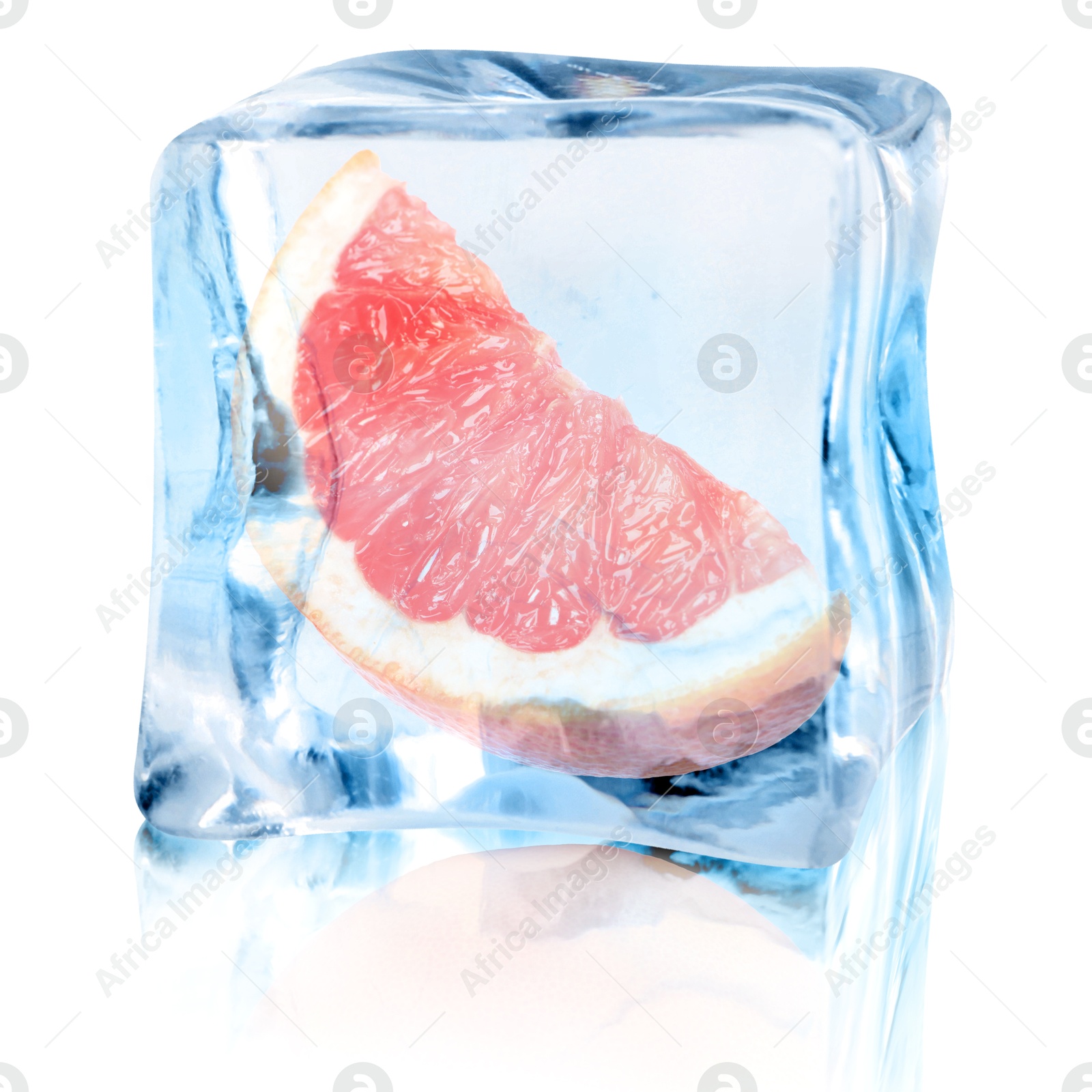 Image of Piece of fresh grapefruit inside ice cube on white background