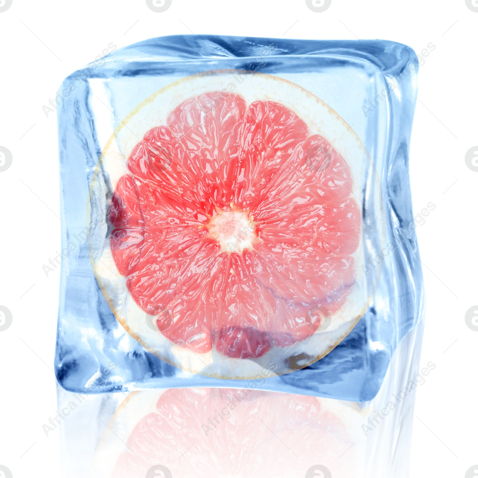 Image of Half of fresh grapefruit inside ice cube on white background