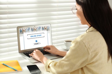 Image of Online study. Woman using laptop for e-learning at desk