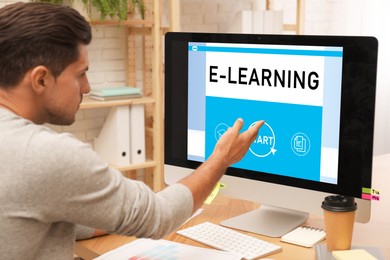 Image of E-learning concept. Man studying online using computer at desk
