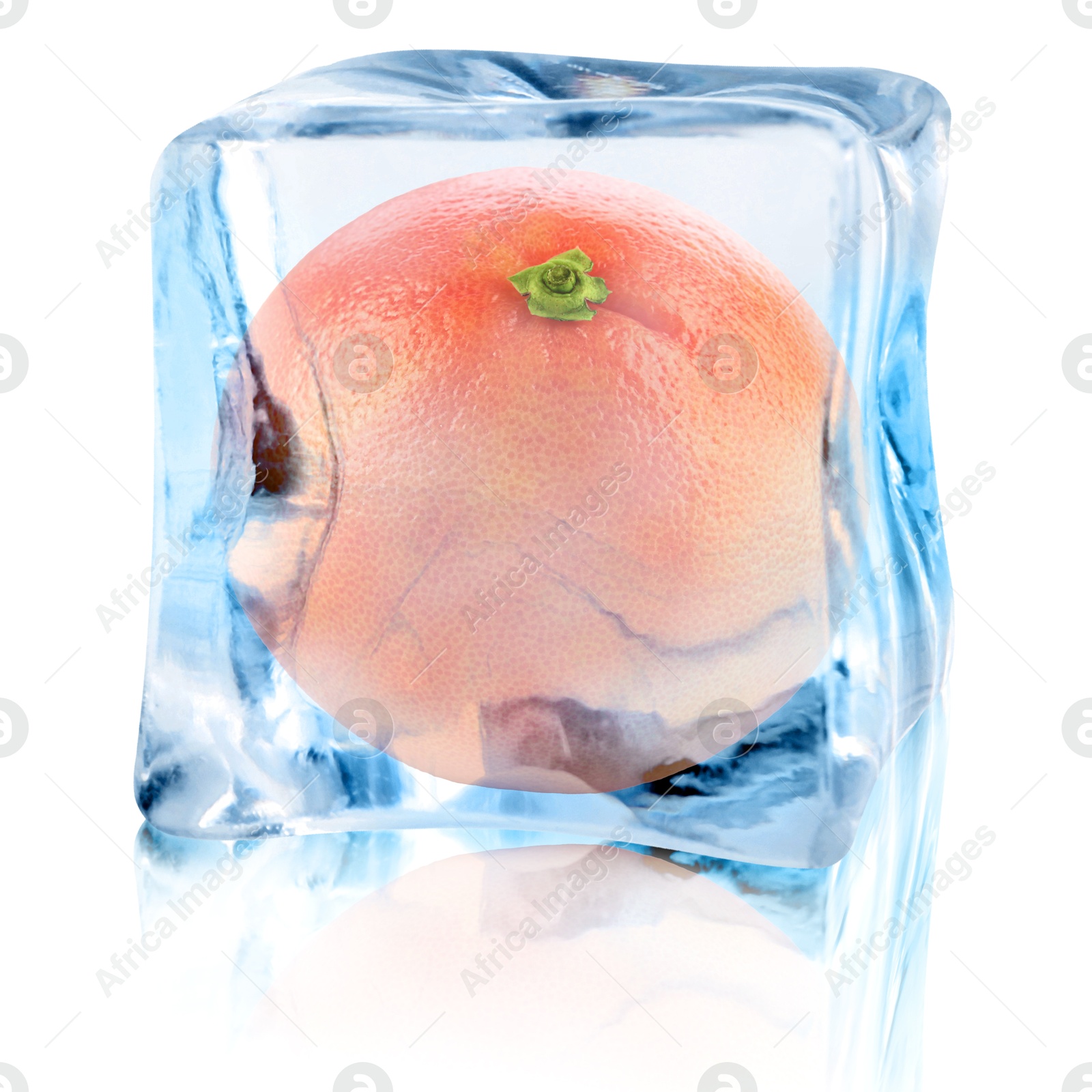 Image of Fresh grapefruit inside ice cube on white background